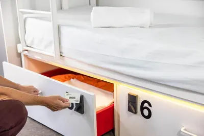 a room with a bed in a bunk room at Urbany Hostel BCN GO! in Barcelona