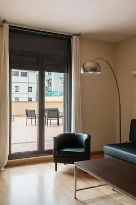 a kitchen with a washer and a stove and a refrigerator at Barcelona Apartment Villarroel in Barcelona