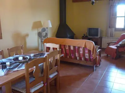 a dining room with a table and a table and chairs at Mansion in Maians with Private Pool in Castellfullit del Boix
