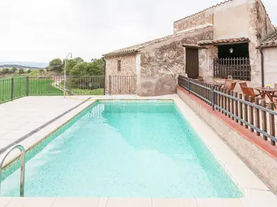 a swimming pool in front of a house at Mansion in Maians with Private Pool in Castellfullit del Boix