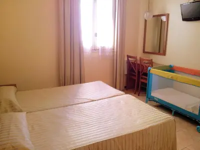 a hospital room with two beds and a window at Hotel Toledano Ramblas in Barcelona