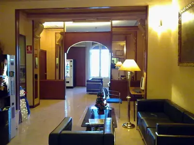 a lobby with couches and a table in a building at Hotel Toledano Ramblas in Barcelona