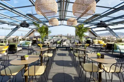 a view of a restaurant with tables and chairs at Hotel Royal Passeig de Gracia in Barcelona