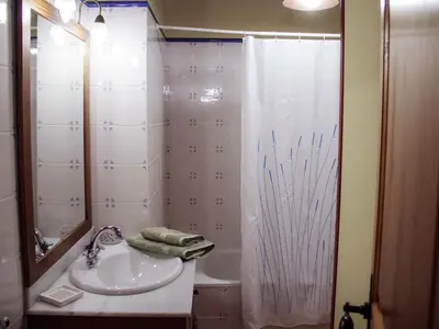 a bathroom with a sink and a shower at Cottage in Maians with Sea View & Pool in Castellfullit del Boix