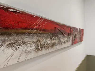a painting hanging on a wall in a museum at Enjoybcn Patio de Gala in Barcelona