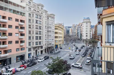a busy city street filled with cars and buildings at Enjoybcn Patio de Gala in Barcelona
