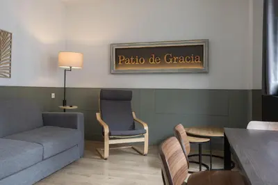 a living room with a couch and a table at Enjoybcn Patio de Gala in Barcelona