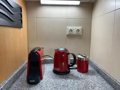 two red and black appliances sitting on a counter at Urban Manresa-City center apartment with balcony in Manresa