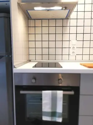 a kitchen with a sink and a stove top oven at Mazi Apartments Suite in Mataró