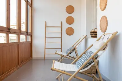 two rocking chairs in a room with a window at EG42B - Piso modernista 6 pax con WIFI en centro Barcelona in Barcelona