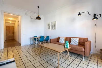 a living room with a couch and a table at EG42B - Piso modernista 6 pax con WIFI en centro Barcelona in Barcelona