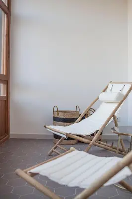 a couple of rocking chairs in a room at EG42B - Piso modernista 6 pax con WIFI en centro Barcelona in Barcelona