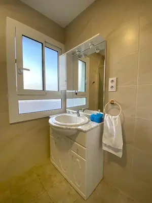 a bathroom with a sink and a mirror at Hostel Penedes in Vilafranca del Penedès