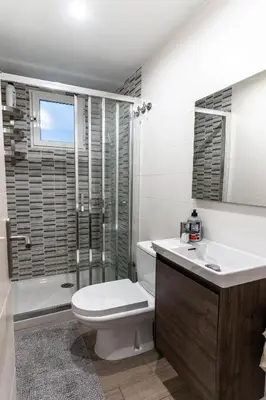 a bathroom with a toilet and a sink and a shower at Magnifico apartamento camp nou in Barcelona