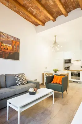 a living room with a couch and a coffee table at Stay U-nique Apartments Eixample Center in Barcelona