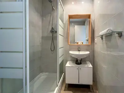 a bathroom with a shower and a sink and a mirror at Stay U-nique Apartments Begur in Barcelona