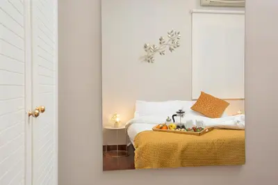 a bedroom with a bed with a tray of fruit on it at Stay U-nique Apartments Calvet in Barcelona