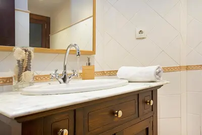 a bathroom with a sink and a mirror at Stay U-nique Apartments Calvet in Barcelona