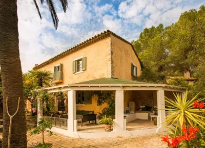 a large house with a patio and a house at Manor House at Masia Nur Sitges, Adults only in Canyelles