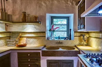 a kitchen with two sinks and a window at Manor House at Masia Nur Sitges, Adults only in Canyelles
