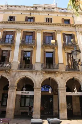 a large building with arches in front of it at Pensión Villanueva in Barcelona