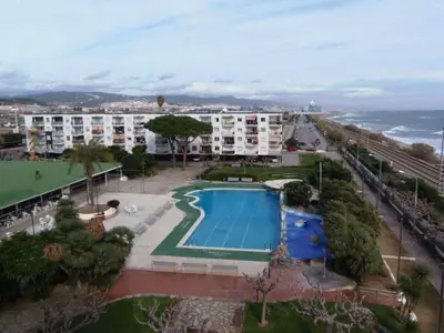 an aerial view of a resort with a swimming pool at Precioso apartamento en la playa Barcelona in Cabrera de Mar