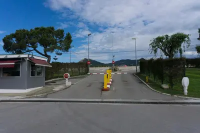 an empty street with a road with yellow barriers at Precioso apartamento en la playa Barcelona in Cabrera de Mar