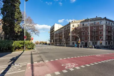 an empty street with a bike lane on the road at Three bedrooms apartment in Barcelona