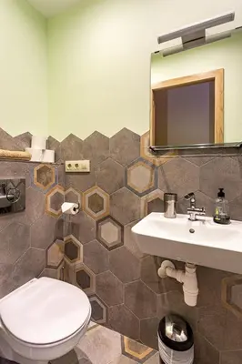 a bathroom with a toilet and a sink and a mirror at Three bedrooms apartment in Barcelona