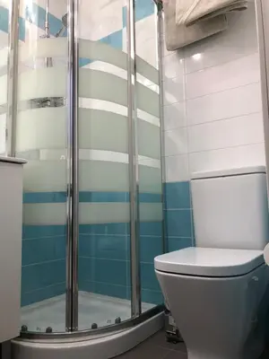 a bathroom with a toilet and a shower at BADAROSA House10min to BARCELONA City&NearTo BEACH in Badalona