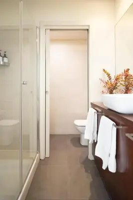 a bathroom with a shower and a toilet and a sink at Casa Felipa Plaza España in Barcelona