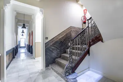 a staircase in a home with white walls and a stair case at Ola Living Music in Barcelona