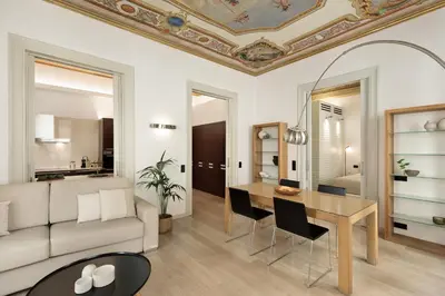 a living room with a table and a couch at Ola Living Portaferrissa in Barcelona