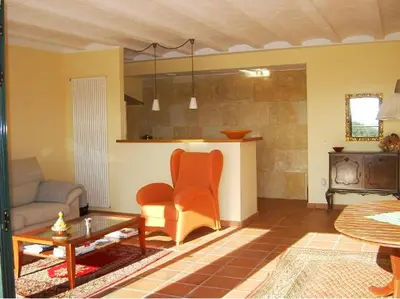 a living room with a couch and a table at CAN MAGINET in Avinyonet