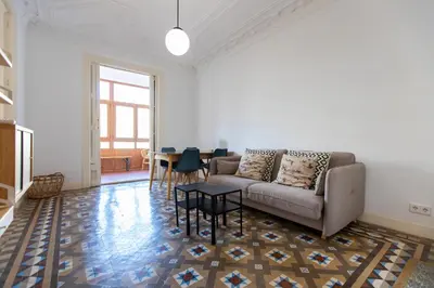 a living room with a couch and a table at eg21- MODERNIST AND ELEGANT APARTMENT IN BCN CITY CENTER in Barcelona