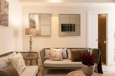 a living room with a couch and a tv at Chic Apartments Barcelona in Barcelona