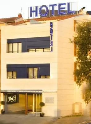 a hotel with a sign on the front of it at Hotel Verti in Corró de Vall