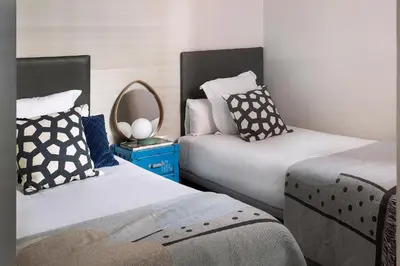 two beds sitting next to each other in a room at C211 Barcelona - Simaba Group in Barcelona