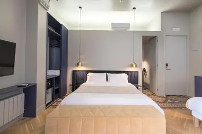 a hallway with a wooden door in a building at BUHO Boutique Rooms in Barcelona