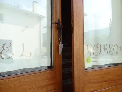 a wooden door with the word cocoa written on it at El Porxo de Can Baixeres PB-00318 in Montseny