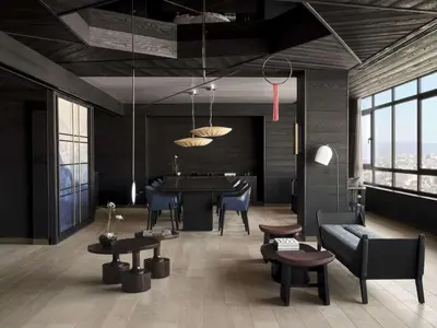 a living room with a table and chairs at Nobu Hotel Barcelona in Barcelona