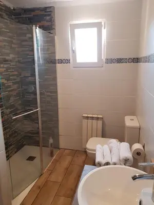 a bathroom with a shower and a sink and a toilet at Apartament Vall de Montserrat in Castellbell i Vilar