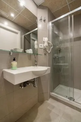 a bathroom with a sink and a shower at Hostal House in Barcelona