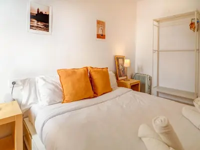 a kitchen and dining room with a table and chairs at Gladiator Apartment by Hello Homes Sitges in Sitges