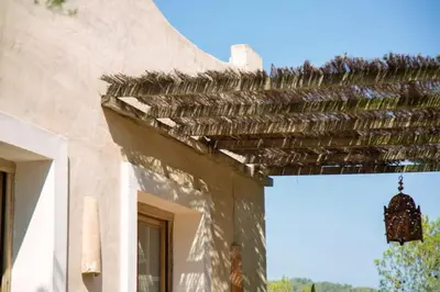 a building with a roof with a chandelier on it at Villa Hermosa at Masia Nur Sitges, Adults only in Canyelles