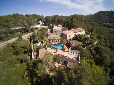 an aerial view of a house with a swimming pool at Casa Azul at Masia Nur Sitges, Adults only in Canyelles