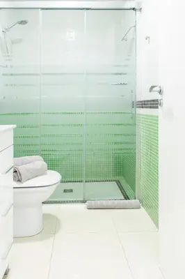 a bathroom with a glass shower with a toilet at Apartamento Montroig 2 in Sitges