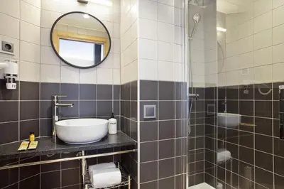 a bathroom with a sink and a mirror at Hotel Brick Barcelona in Barcelona