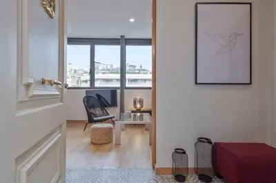 a hallway with a door leading to a room with a window at SibsBcn Downtown Penthouse in Barcelona