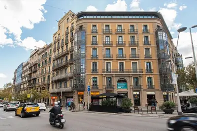 a large building on a city street with cars at SibsBcn Downtown Penthouse in Barcelona